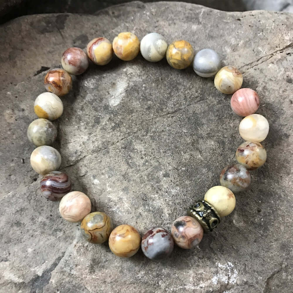 Crazy Lace Agate Bead Bracelet This bracelet is made with high-quality Crazy Lace Agate stones which bring optimism to the wearer. Zodiac Sign: Gemini. Chakras: Third Eye and Crown. Handmade with authentic crystals and gemstones in Minneapolis, MN.