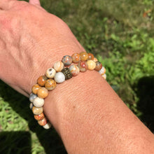 Load image into Gallery viewer, Crazy Lace Agate Bead Bracelet This bracelet is made with high-quality Crazy Lace Agate stones which bring optimism to the wearer. Zodiac Sign: Gemini. Chakras: Third Eye and Crown. Handmade with authentic crystals and gemstones in Minneapolis, MN.
