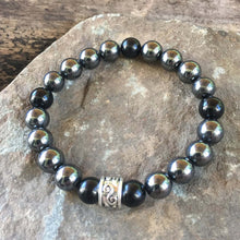 Load image into Gallery viewer, Hematite and Black Obsidian Bead Bracelet This bracelet is made with high-quality Hematite and Black Obsidian stones which bring balance and self-awareness to the wearer. Zodiac Signs: Aquarius, Aries, and Scorpio. Chakras: Root. Handmade with authentic c
