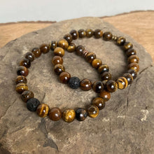 Load image into Gallery viewer, Tiger Eye Bead Bracelet This bracelet is made with high-quality Tiger Eye gemstones which bring protection and connection to the wearer. Chakras: Sacral, Solar Plexus, and Third Eye. Handmade with authentic crystals &amp; gemstones in Minneapolis, MN.
