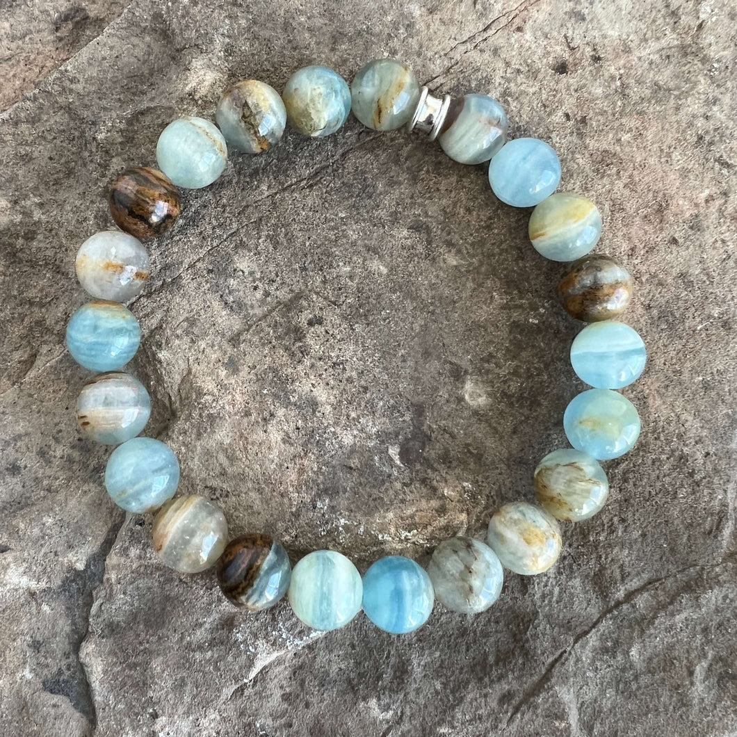 Lemurian Aquatine Calcite Bracelet Lemurian Aquatine Calcite is also known as Blue Argentinian Calcite, Argentinian Blue Onyx and Argentinian Aquamarine Onyx, as the main source of this stone comes from (as you can probably guess) Argentina. Lemurian Aqua