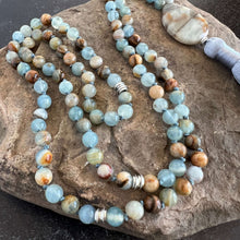 Load image into Gallery viewer, Lemurian Aquatine Calcite Mala The name of this particular calcite probably came about because of its distinct ocean blue and tan bands, denoting a strong land/water connection. Also known as Blue Argentinian Calcite, Argentinian Blue Onyx and Argentinian
