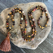 Load image into Gallery viewer, Tiger Eye Mala This mala is made with brown Tiger Eye, Red Tiger Eye, and Mookaite stones which bring a stable, grounding energy to the wearer. Due to the uniqueness of natural stone, your mala may look slightly different than the one pictured. Making you
