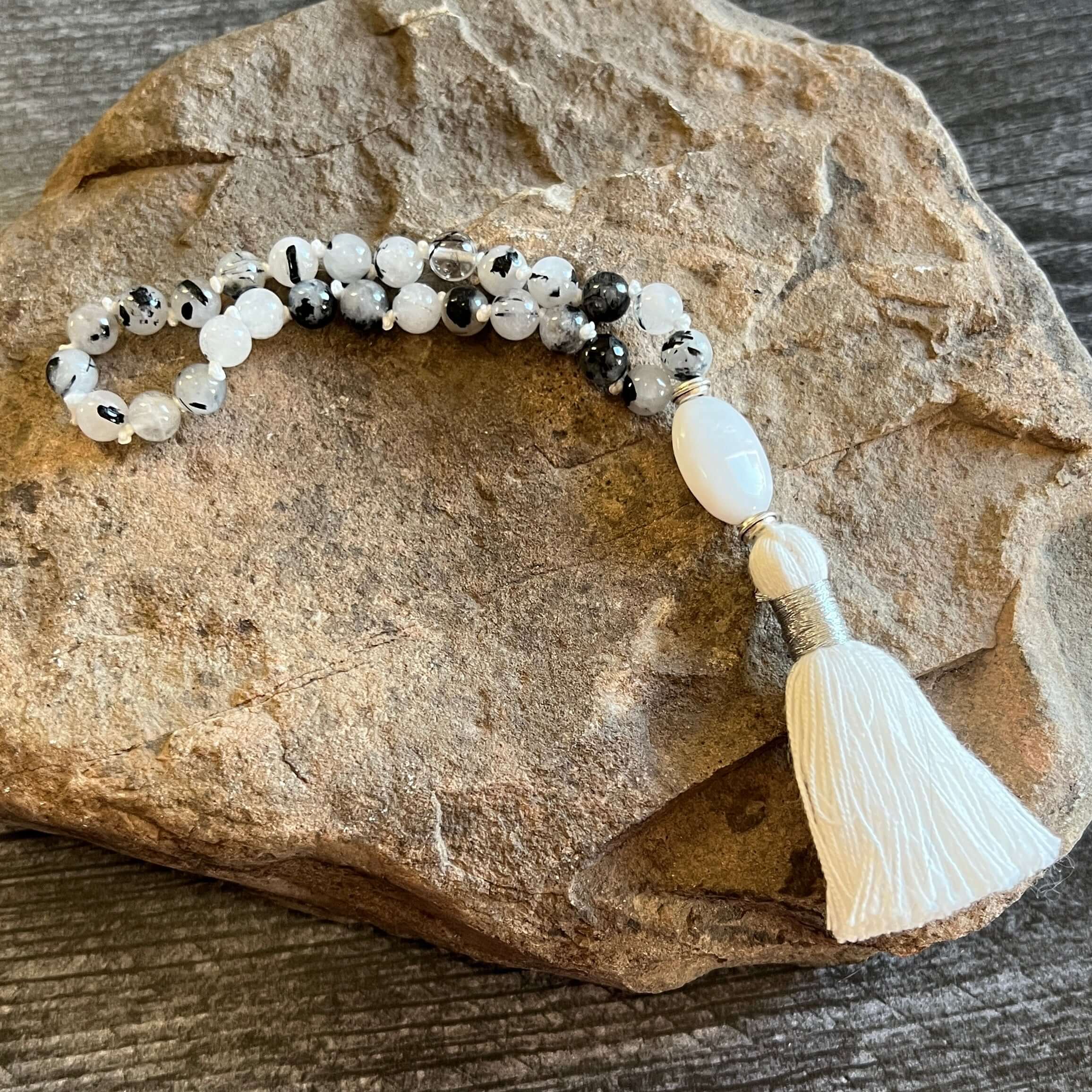 Tourmaline Quartz Wrist Mala These quarter malas are made with high-quality Tourmaline Quartz and Jasper gemstones which bring protection and tranquility to the wearer. Jasper is known as the “supreme nurturer.” Zodiac Signs: Libra, Scorpio, and Leo. Chak