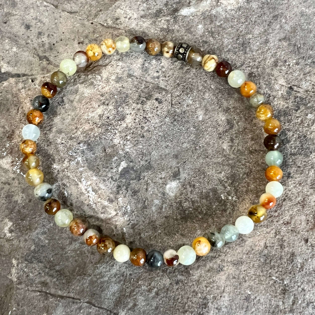 Flower Jade Mini Bead Bracelet This bracelet is made with high-quality Flower Jade stones which bring balance to the wearer. Zodiac Signs: Aries, Taurus, Gemini, and Libra. Chakra: Heart and Solar Plexus. Handmade with authentic crystals and gemstones in