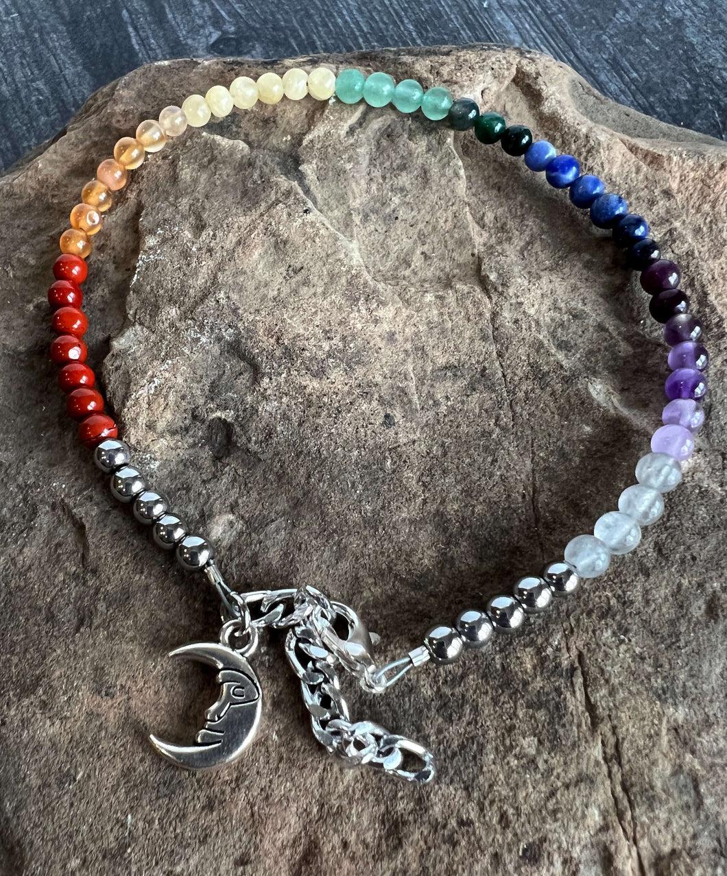 Rainbow Beaded Anklet This anklet is made with a variety of high-quality, natural stones to create a rainbow. The anklet can be a representation of our chakra system and can also be a way to show your pride or support for the LGBTQ+ community. Handmade wi