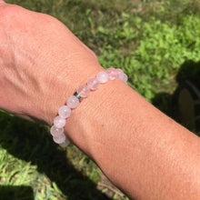 Load image into Gallery viewer, Rose Quartz Bead Bracelet This bracelet is made with high-quality Rose Quartz gemstones which bring love and purification to the wearer. Zodiac Sign: Taurus. Chakra: Heart. Handmade with authentic crystals &amp; gemstones in Minneapolis, MN.
