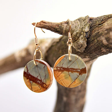 Red Creek Jasper Circle Earrings These earrings are made with high-quality Red Creek Jasper gemstones which bring balancing energy to the wearer. Zodiac Signs: Aries, Scorpio Chakras: Root, Sacral. Handmade with authentic crystals & gemstones in Minneapol
