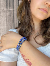 Load image into Gallery viewer, Sodalite Bracelet This bracelet is made with high-quality Sodalite gemstones which bring logic and intuition to the wearer. Zodiac Signs: Virgo and Sagittarius. Chakras: Throat and Third Eye. Handmade with authentic crystals &amp; gemstones in Minneapolis, MN
