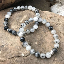 Load image into Gallery viewer, Tourmaline Quartz Bracelet This bracelet is made with high-quality Tourmaline Quartz gemstones which bring balance and luck to the wearer. Zodiac Signs: Libra, Scorpio Chakra: Root. Handmade with authentic crystals &amp; gemstones in Minneapolis, MN.

