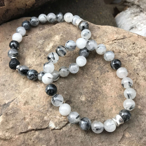Tourmaline Quartz Bracelet This bracelet is made with high-quality Tourmaline Quartz gemstones which bring balance and luck to the wearer. Zodiac Signs: Libra, Scorpio Chakra: Root. Handmade with authentic crystals & gemstones in Minneapolis, MN.