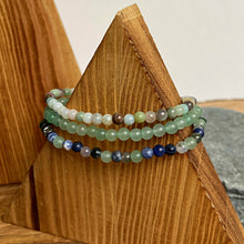 Load image into Gallery viewer, Picture of 3 bracelets included with bracelet set. Bottom one is made with sodalite, moss agate, and green aventurine stones. Second is green aventurine. Top is amazonite.
