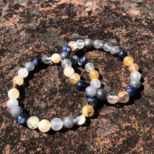 Load image into Gallery viewer, Oregon Coast Bead Bracelet This bracelet is made with high-quality Sodalite, Cloudy Quartz, and Yellow Jade gemstones which bring self-confidence, focus, and creativity to the wearer. Zodiac Signs: Sagittarius, Aries &amp; Pisces. Chakras: Throat, Third Eye,
