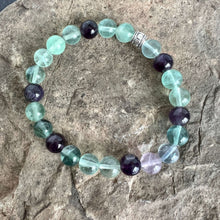 Load image into Gallery viewer, Fluorite and Amethyst Bead Bracelet This bracelet is made with high-quality Fluorite and Amethyst stones which bring stability, protection and awareness to the wearer. Zodiac Sign: Capricorn. Chakra: Heart. Handmade with authentic crystals and gemstones i

