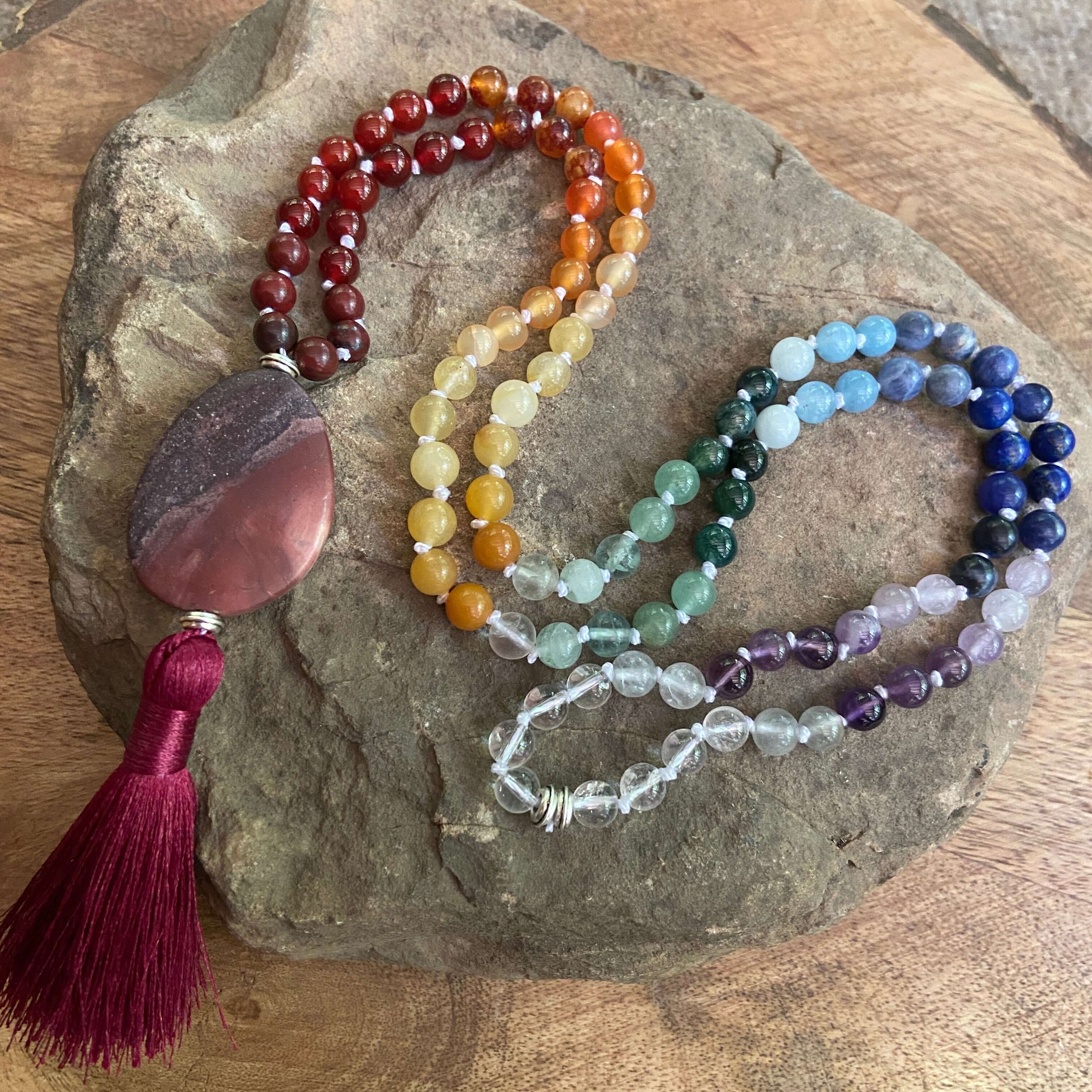 Rainbow Mala This mala is made with a variety of high-quality, natural stones to create a rainbow. The mala can be a representation of our chakra system and can also be a way to show your pride or support for the LGBTQ+ community. Handmade with authentic