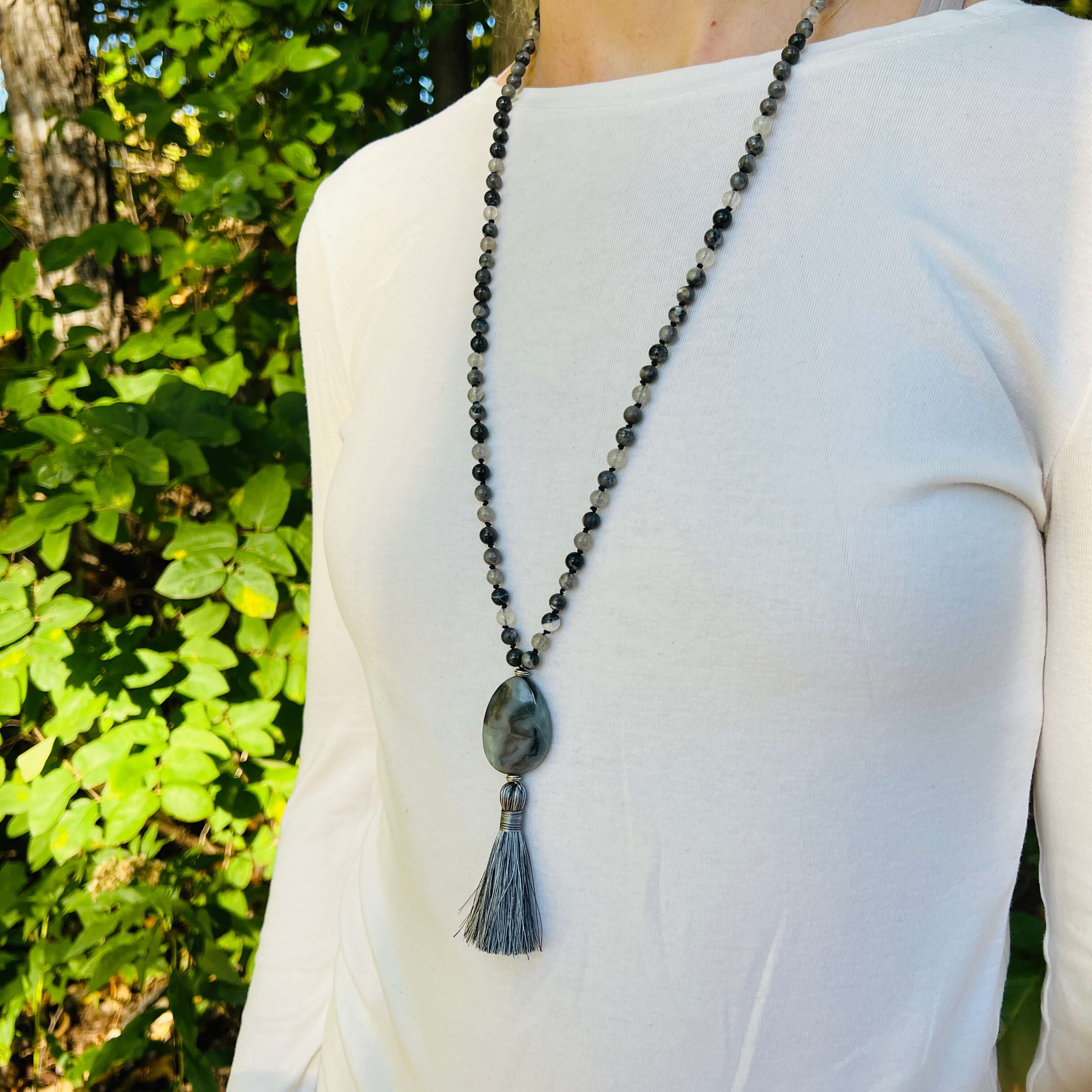 Transformation Mala This mala is made with 6mm Blue Labradorite, Cloud Quartz, and Amazonite beads. The guru stone is Amazonite. It is strung on black nylon thread and hand knotted between each stone. Blue Labradorite is a stone of transformation and chan
