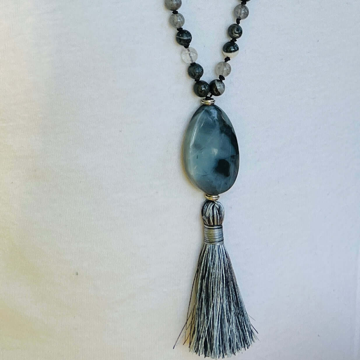 Transformation Mala This mala is made with 6mm Blue Labradorite, Cloud Quartz, and Amazonite beads. The guru stone is Amazonite. It is strung on black nylon thread and hand knotted between each stone. Blue Labradorite is a stone of transformation and chan