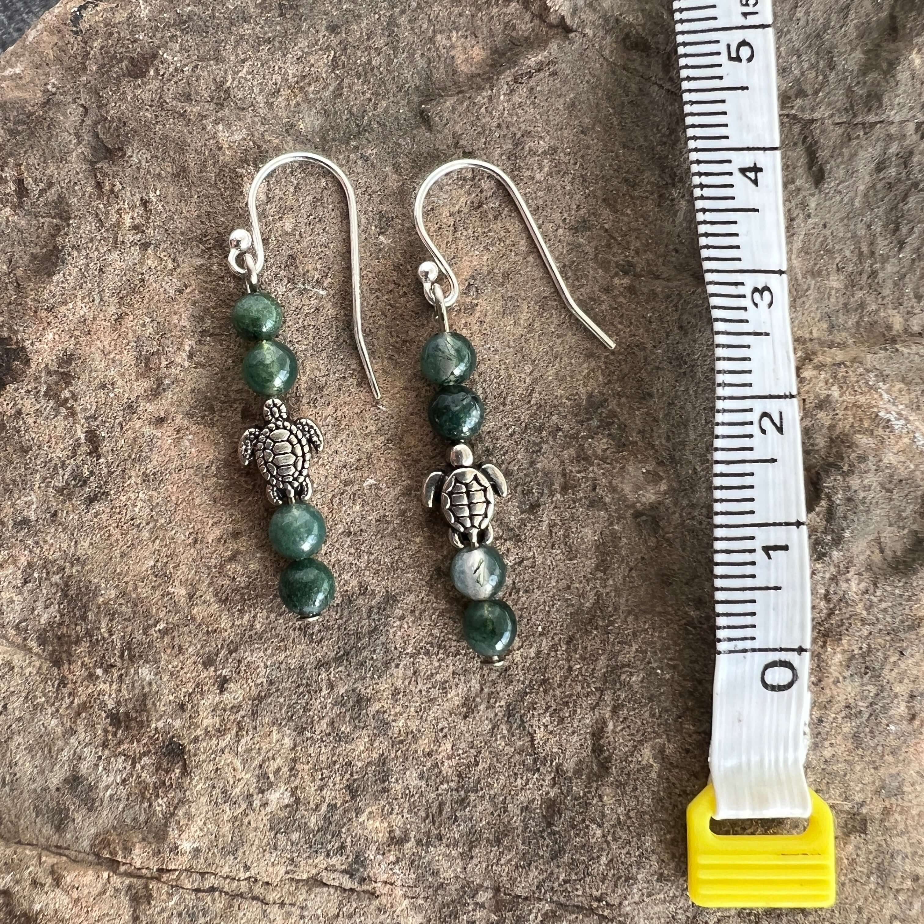 Turtle Charm Earrings These earrings are made with high-quality Moss Agate gemstones which bring abundance and grounding energy to the wearer. Turtle symbolism includes longevity, perseverance, steadfastness, protection, retreat, healing, tranquility, the