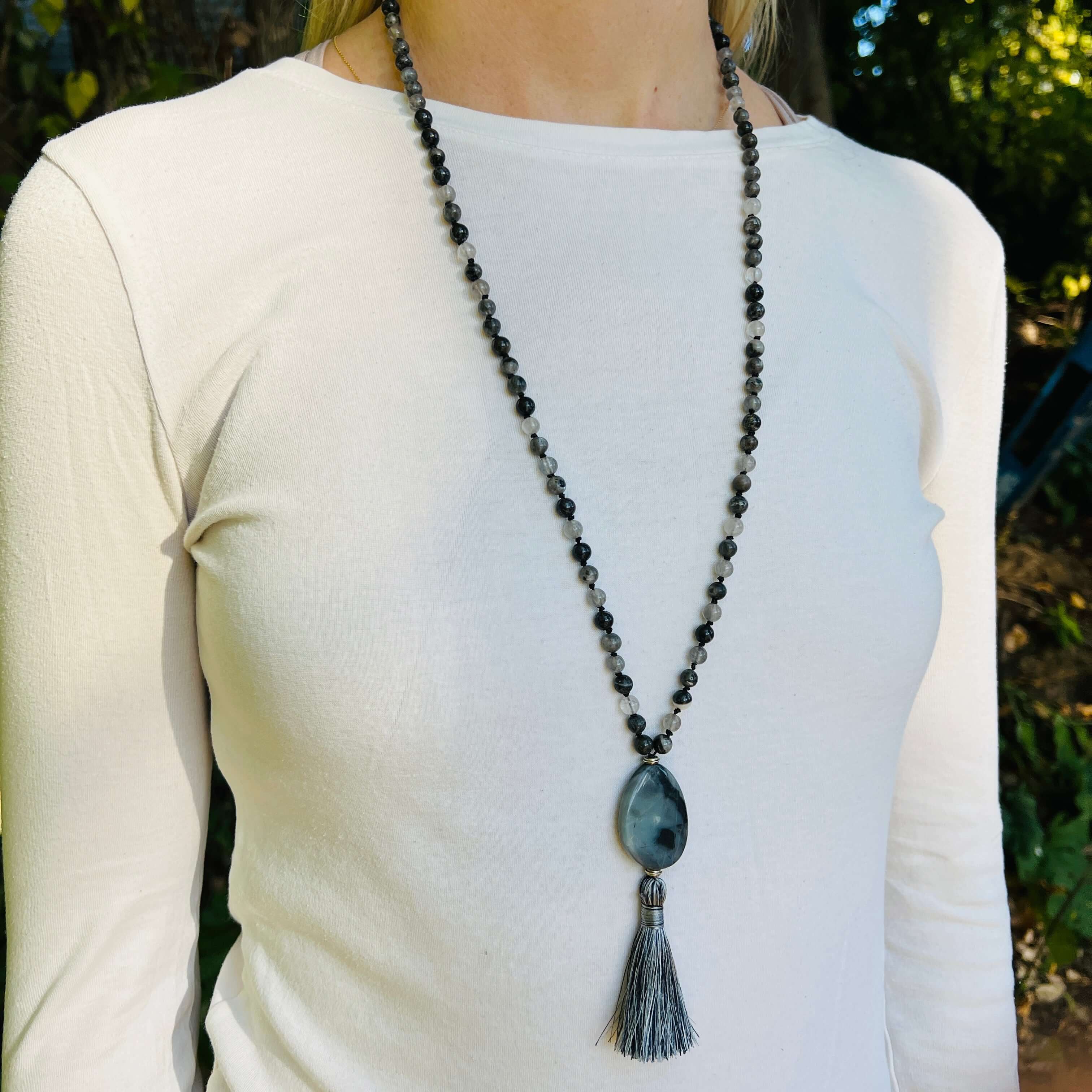 Transformation Mala This mala is made with 6mm Blue Labradorite, Cloud Quartz, and Amazonite beads. The guru stone is Amazonite. It is strung on black nylon thread and hand knotted between each stone. Blue Labradorite is a stone of transformation and chan
