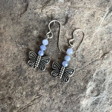 Load image into Gallery viewer, Devon&#39;s Butterfly Earrings These earrings are made with genuine Tanzanite stones with a pewter Butterfly. All profits from the sale of these earrings will be donated to the Pediatric Heart Program at Children&#39;s Hospital MN in memory of Devon Jenson, the h
