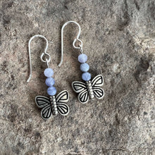 Load image into Gallery viewer, Devon&#39;s Butterfly Earrings These earrings are made with genuine Tanzanite stones with a pewter Butterfly. All profits from the sale of these earrings will be donated to the Pediatric Heart Program at Children&#39;s Hospital MN in memory of Devon Jenson, the h

