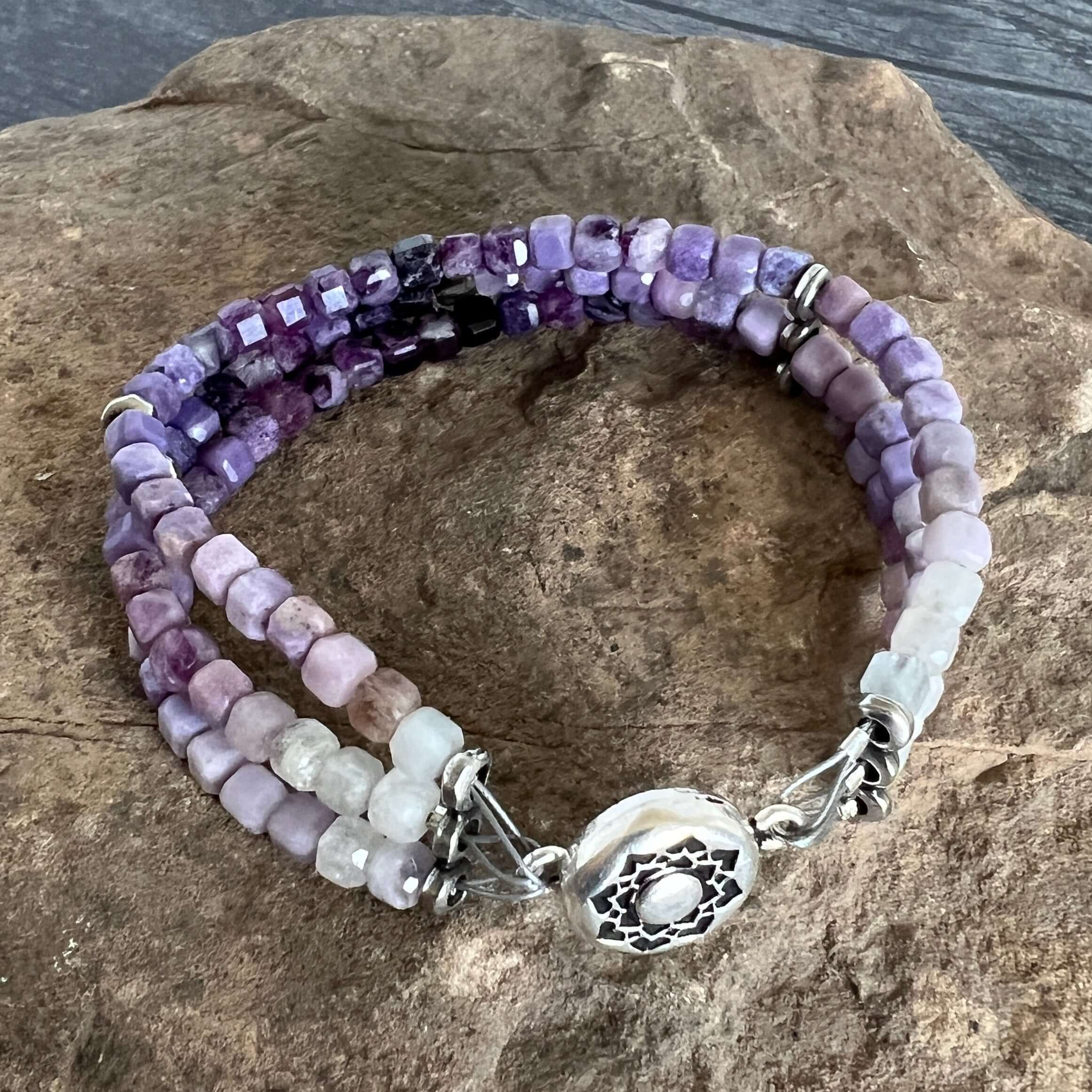 Silky Fluorite Stacked Bracelet Silky Fluorite is a rare form of Fluorite with a silky opaque luster. The luster appearance is from quartz inclusions. These quartz inclusions influence the passing of light through the mineral thus creating a silky, fibrou