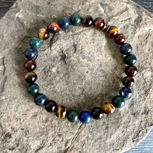 Load image into Gallery viewer, Deep Woods Bracelet This bracelet is made with two types of Tiger Eye stones, along with Bloodstone and Sodalite. Brought together, this creates a very rooted and grounded energy, allowing the wearer to be clear minded, as well as feeling very secure and
