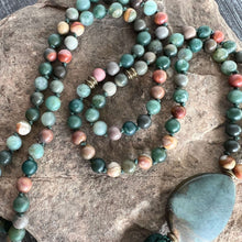 Load image into Gallery viewer, Forest Walk Mala This mala is made with high-quality Agate and Jasper gemstones which bring strength and tranquility to the wearer. Zodiac Signs: Leo, Gemini, Aries, Scorpio, and Virgo. Chakras: Third Eye, Root, Crown, and Heart. Handmade with authentic c
