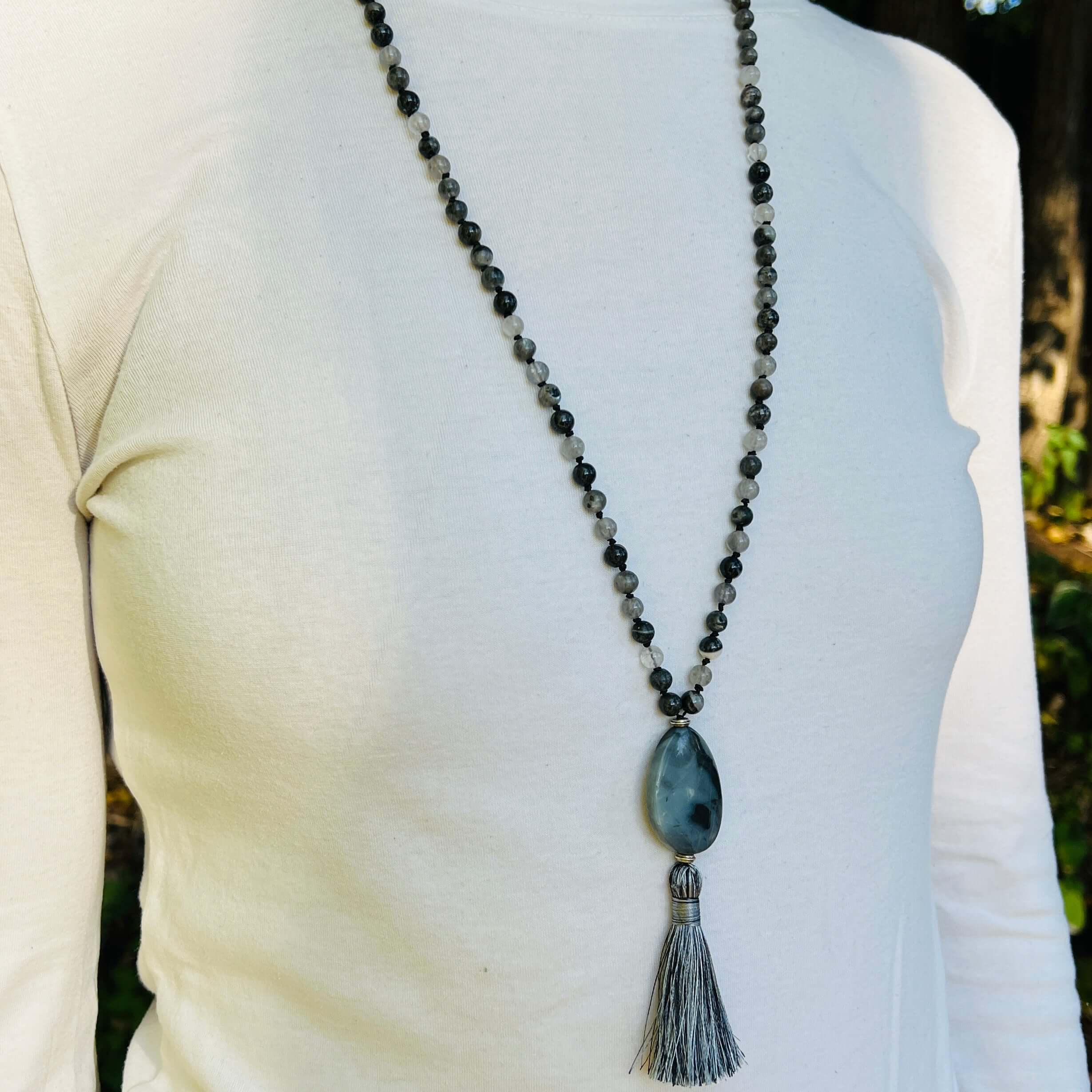 Transformation Mala This mala is made with 6mm Blue Labradorite, Cloud Quartz, and Amazonite beads. The guru stone is Amazonite. It is strung on black nylon thread and hand knotted between each stone. Blue Labradorite is a stone of transformation and chan