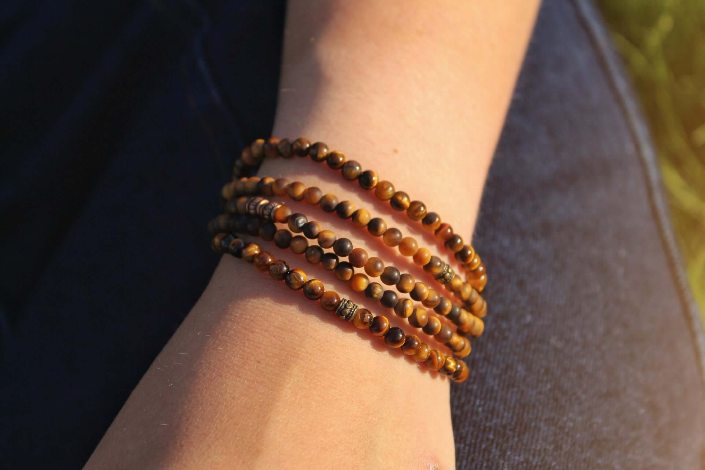 Tiger Eye Mini Bead Bracelet This bracelet is made with high-quality Tiger Eye gemstones which bring grounding and protective energy to the wearer. Zodiac Signs: Leo and Capricorn. Chakras: Sacral, Solar Plexus, and Third Eye. Handmade with authentic crys