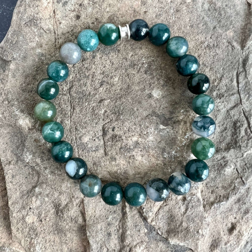 Moss Agate Bracelet This bracelet is made with high-quality Moss Agate gemstones which bring abundance and grounding energy to the wearer. Zodiac Sign: Virgo. Chakra: Heart. Handmade with authentic crystals & gemstones in Minneapolis, MN.