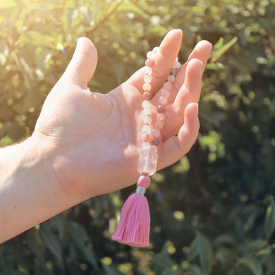 Rose Quartz Wrist Mala These quarter malas are made with high-quality Rose Quartz, Lepidolite, and Moonstone beads which bring love, release, and inspiration to the wearer. Zodiac Signs: Libra and Taurus. Chakras: Third Eye, Crown, Heart and Sacral. Handm
