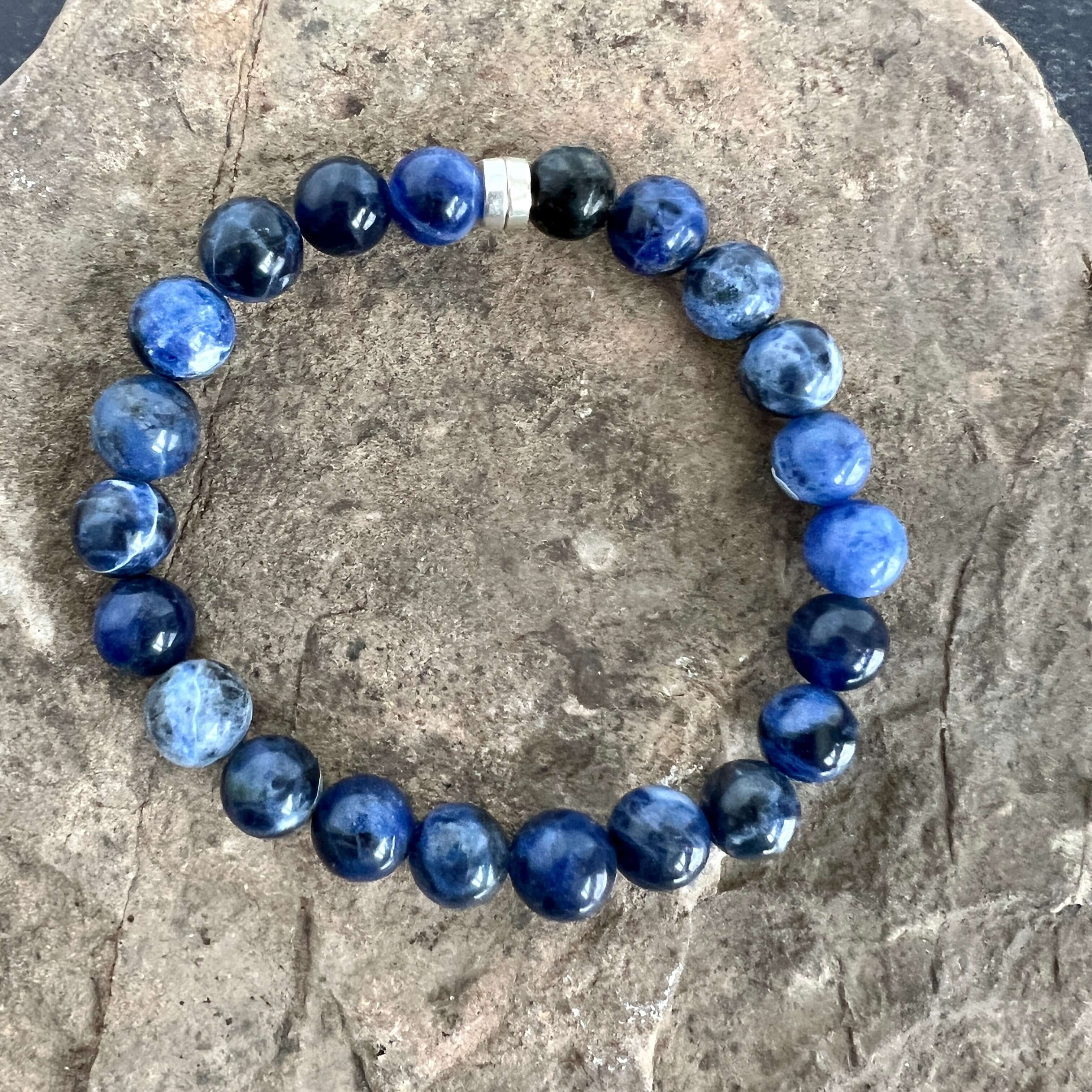 Sodalite Bracelet This bracelet is made with high-quality Sodalite gemstones which bring logic and intuition to the wearer. Zodiac Signs: Virgo and Sagittarius. Chakras: Throat and Third Eye. Handmade with authentic crystals & gemstones in Minneapolis, MN