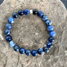 Load image into Gallery viewer, Sodalite Bracelet This bracelet is made with high-quality Sodalite gemstones which bring logic and intuition to the wearer. Zodiac Signs: Virgo and Sagittarius. Chakras: Throat and Third Eye. Handmade with authentic crystals &amp; gemstones in Minneapolis, MN
