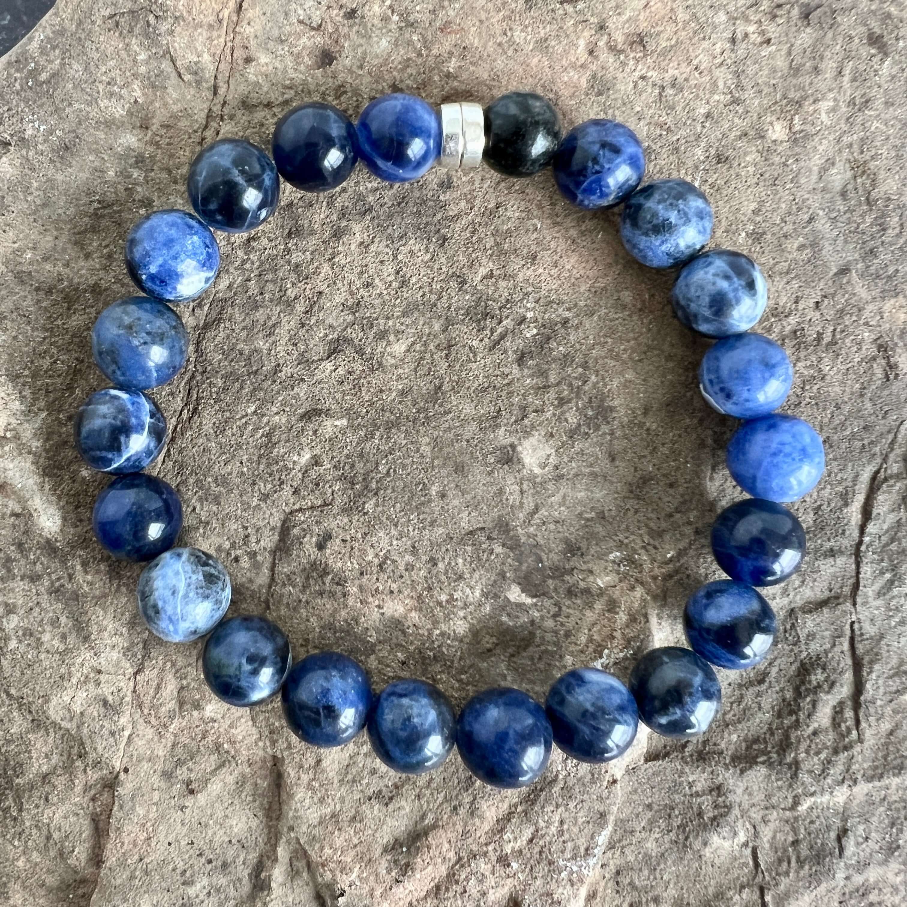 Sodalite Bracelet This bracelet is made with high-quality Sodalite gemstones which bring logic and intuition to the wearer. Zodiac Signs: Virgo and Sagittarius. Chakras: Throat and Third Eye. Handmade with authentic crystals & gemstones in Minneapolis, MN