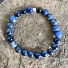 Load image into Gallery viewer, Sodalite Bracelet This bracelet is made with high-quality Sodalite gemstones which bring logic and intuition to the wearer. Zodiac Signs: Virgo and Sagittarius. Chakras: Throat and Third Eye. Handmade with authentic crystals &amp; gemstones in Minneapolis, MN
